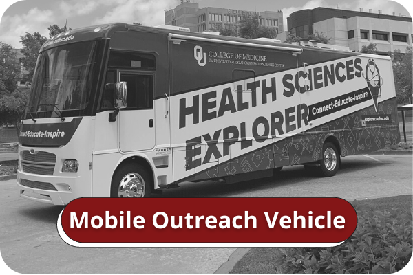 Black and white image of a large bus parked on the HSC Campus. Title on image says "Mobile Outreach Vehicle".